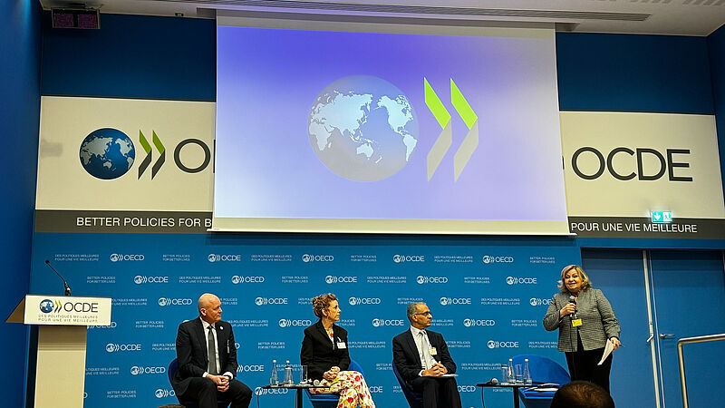 Hall with speakers at the OECD headquarters in Paris, where the annual meeting of the Association of Auditors was held